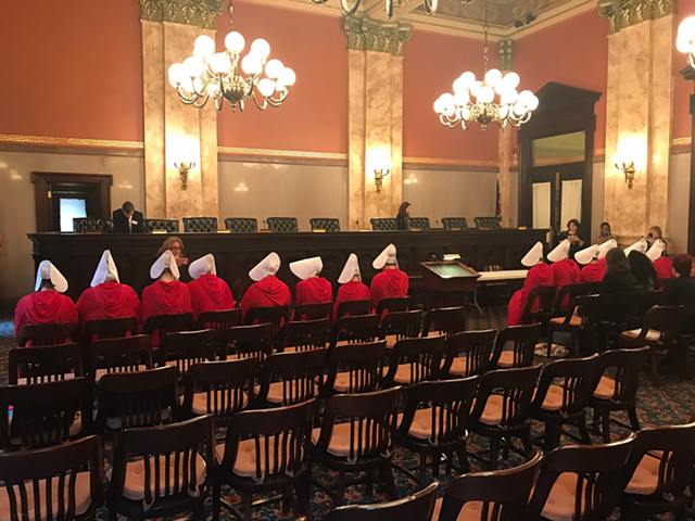 Women dressed as characters from the Handmaid's Tale at an Ohio Senate committee meeting on SB145