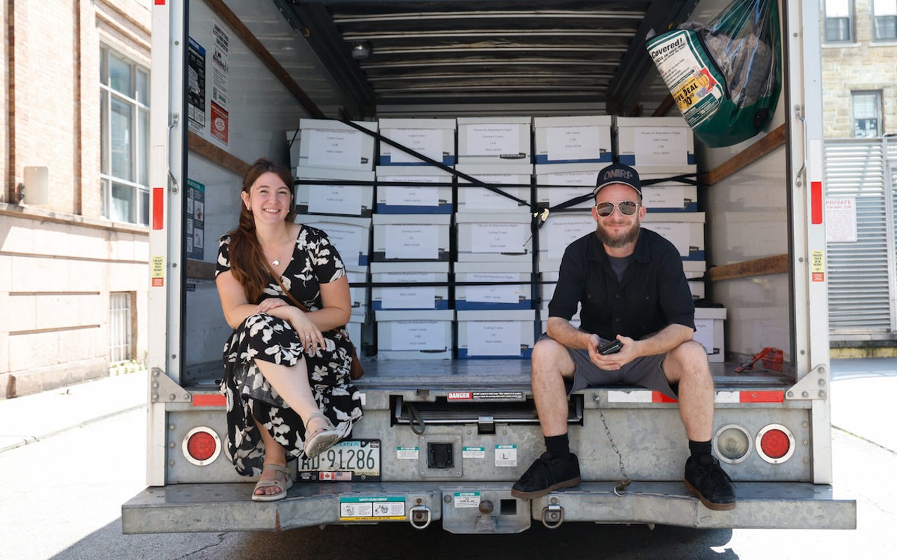 COLUMBUS, Ohio — JULY 05: Field staffer directors for Ohioans United for Reproductive Rights, Dakota DesRochers (left) and Keith Siddall wait to unload the second truck with the remainder of 402 boxes of petitions with over 700,000 signatures being delivered to Ohio Secretary of State Frank LaRose, July 5, 2023, at the loading dock of the Office of the Ohio Secretary of State, downtown Columbus, Ohio.