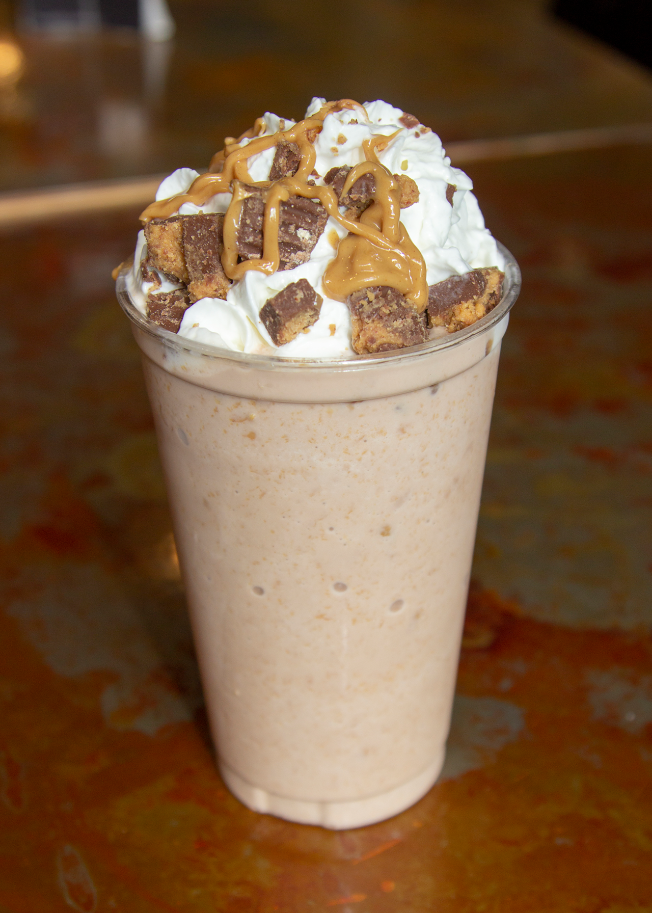 Co-owners Cole and Shane Mounce opened Buzzed Bull Creamery (1408 Main St., OTR) in May of 2017. Fan-favorite Tiger Stripes shake is a tribute to the Cincinnati Bengals. Pictured is a Tiger Stripes Nitro Milkshake with spiced rum, chocolate peanut butter flavor, peanut butter cups and peanut butter sauce—all topped with whipped cream.