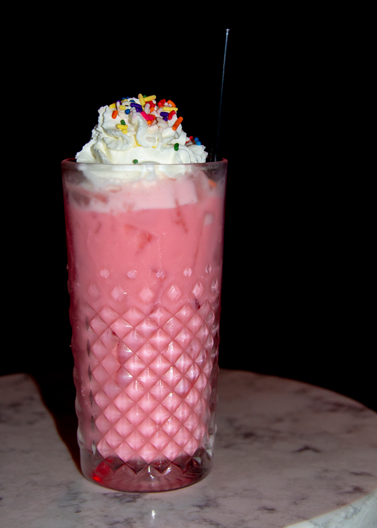The Video Archive (965 E. McMillan Road, East Walnut Hills) is a nostalgic movie store that doubles as a speakeasy. Jason Keeney, general manager, says all drinks are inspired by Quentin Tarantino films, including the famous $5 milkshakes (vanilla, chocolate and strawberry). Pictured is a strawberry milkshake spiked with bourbon, milk, strawberry syrup and house-made bourbon whipped cream.