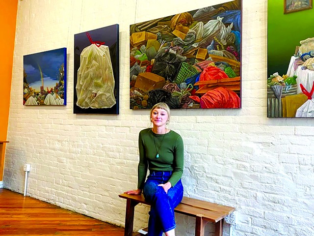 Northern Kentucky artist Devan Horton in front of her series "Penchant."