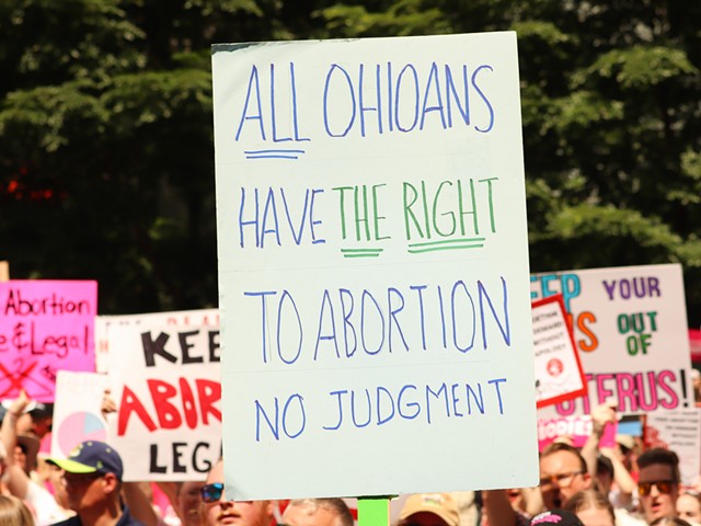 Ohio demonstrators hold signs during protests against the U.S. Supreme Court's June 24 decision to overturn Roe v. Wade.