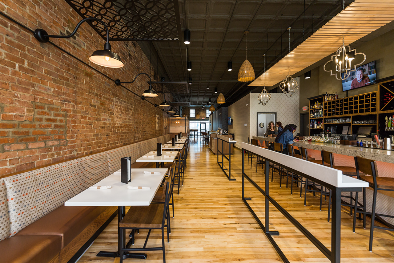 The interior of Aladdin's Eatery's OTR location is industrial meets Mediterranean