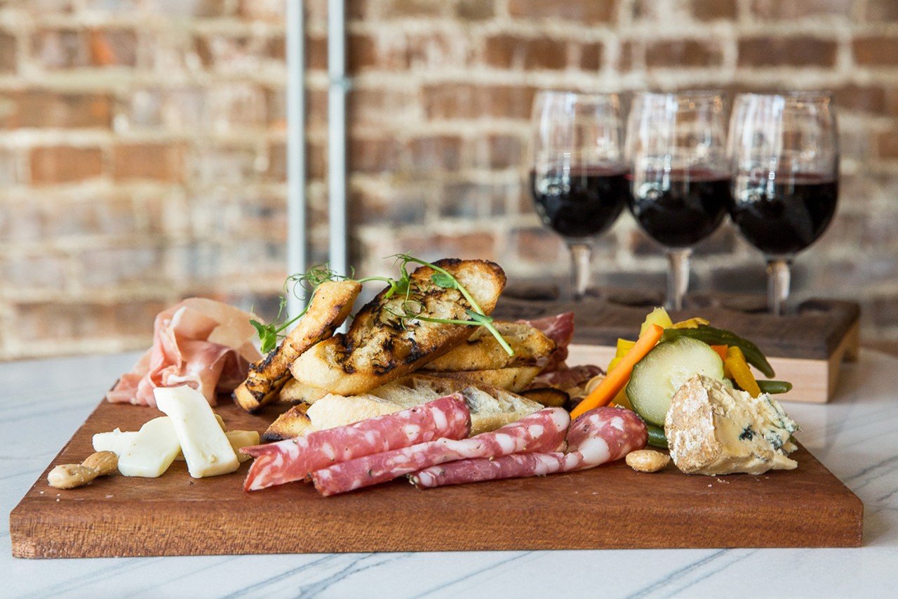 The charcuterie board with a rotating selection of cured meats and cheeses, toast and accompaniments