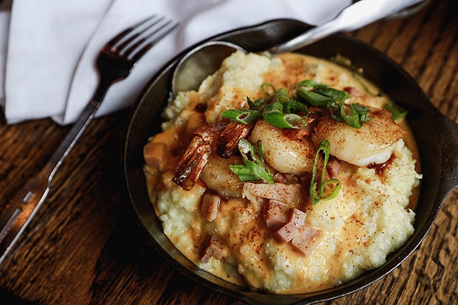 Aunt Sally's Shrimp, a Thai-inspired spin on the classic shrimp and grits, made with lemongrass shrimp, coconut chili gravy and smoked cheddar grits.