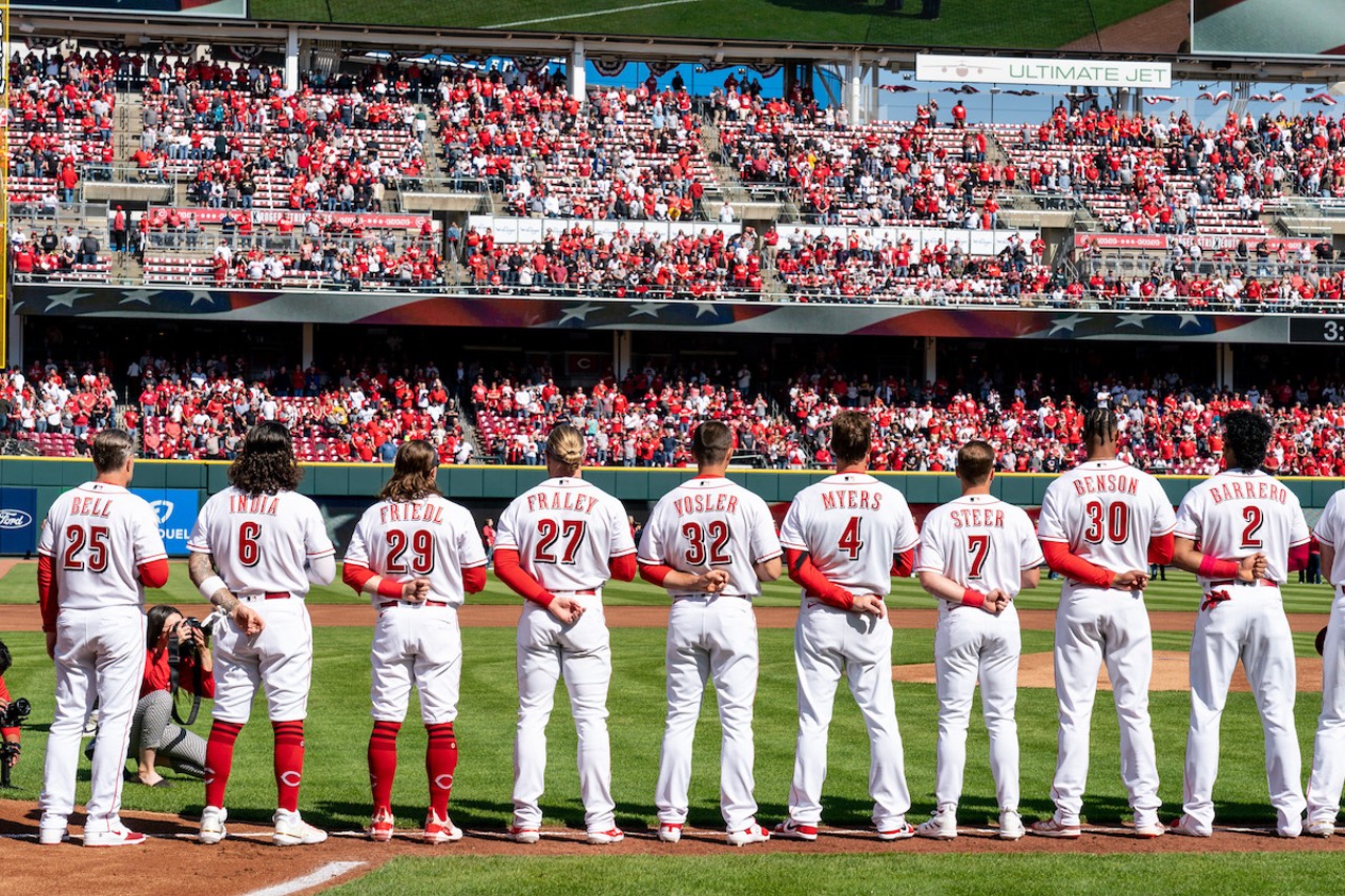 The Cincinnati Reds line up before the season opener at Great American Ball Park on March 30, 2023.