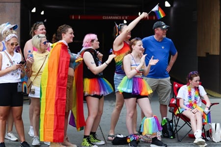 Spectators cheer on participants during the Cincinnati Pride Parade on Saturday, June 22, 2024.