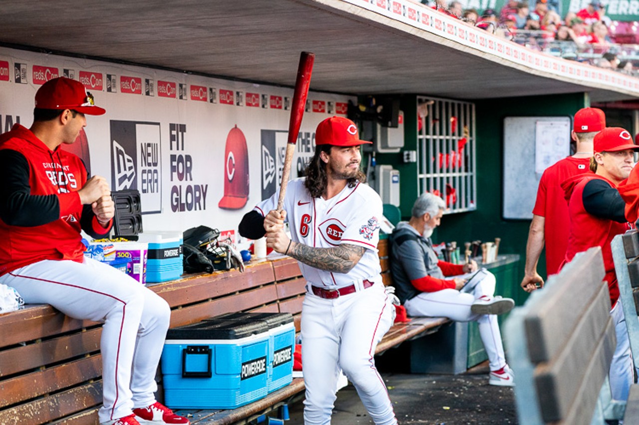 Jonathan India tries a bat in the dugout as the Cincinnati Reds host the Chicago Cubs at Great American Ball Park on Oct. 5, 2022.