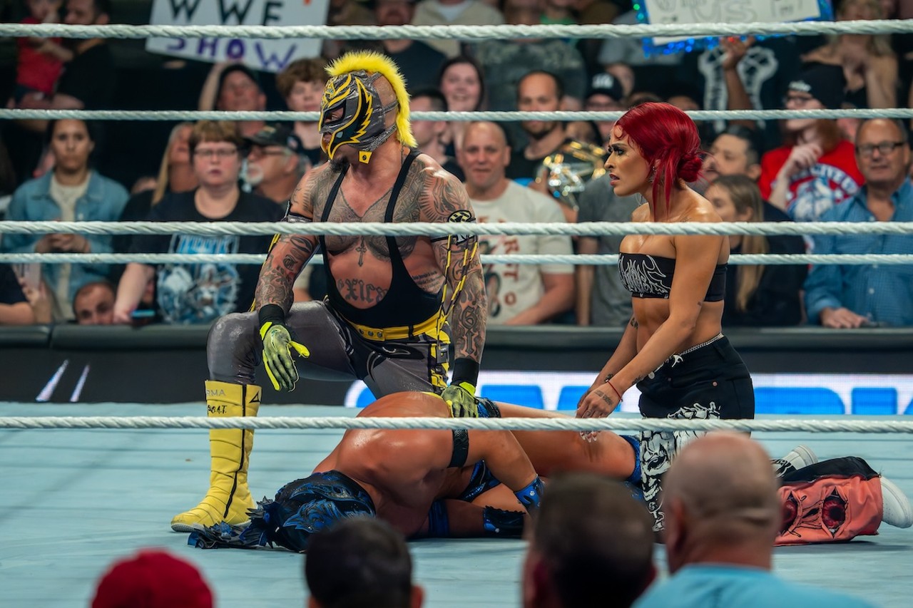 Rey Mysterio and Zelina Vega kneel over a fallen Dragon Lee | WWE Smackdown at Heritage Bank Center on April 26, 2024