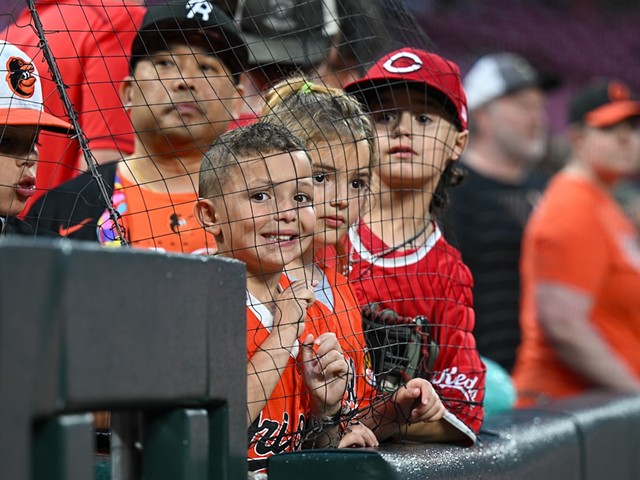 Fans line up against the net, waiting for players to walk onto the field | Cincinnati Reds vs. Baltimore Orioles | May 3, 2024