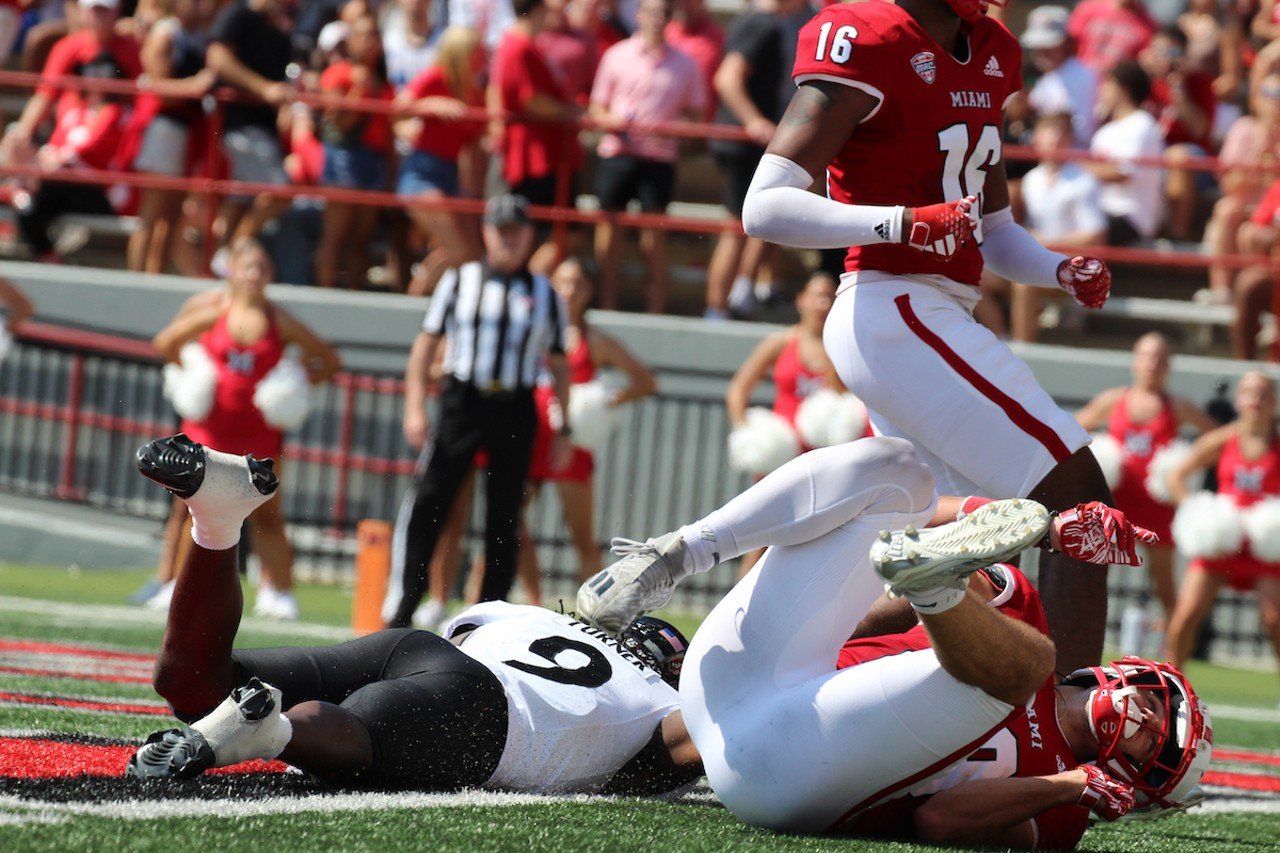 UC wide receiver Aaron Turner is brought down for an incomplete pass.