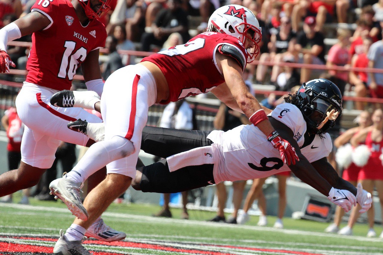 UC wide receiver Aaron Turner is brought down for an incomplete pass.