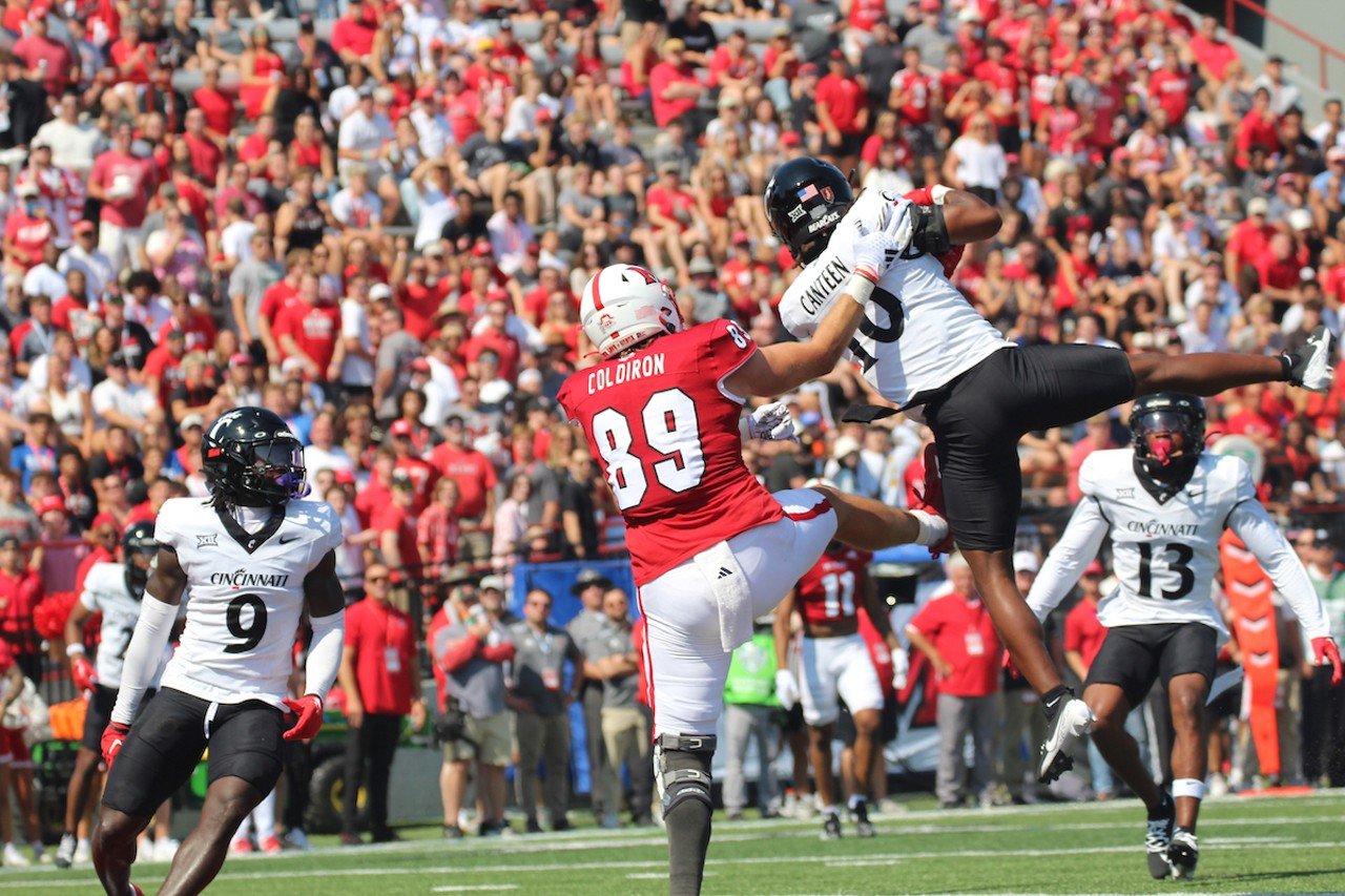 UC defensive back Derrick Canteen makes an interception.