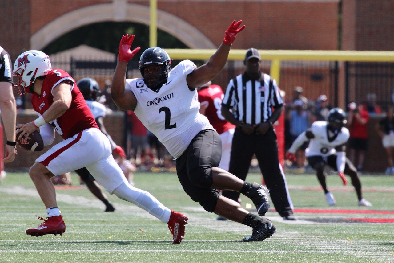 UC defensive tackle Dontay Corleone attempts to sack Miami University quarterback Brett Gabbert.