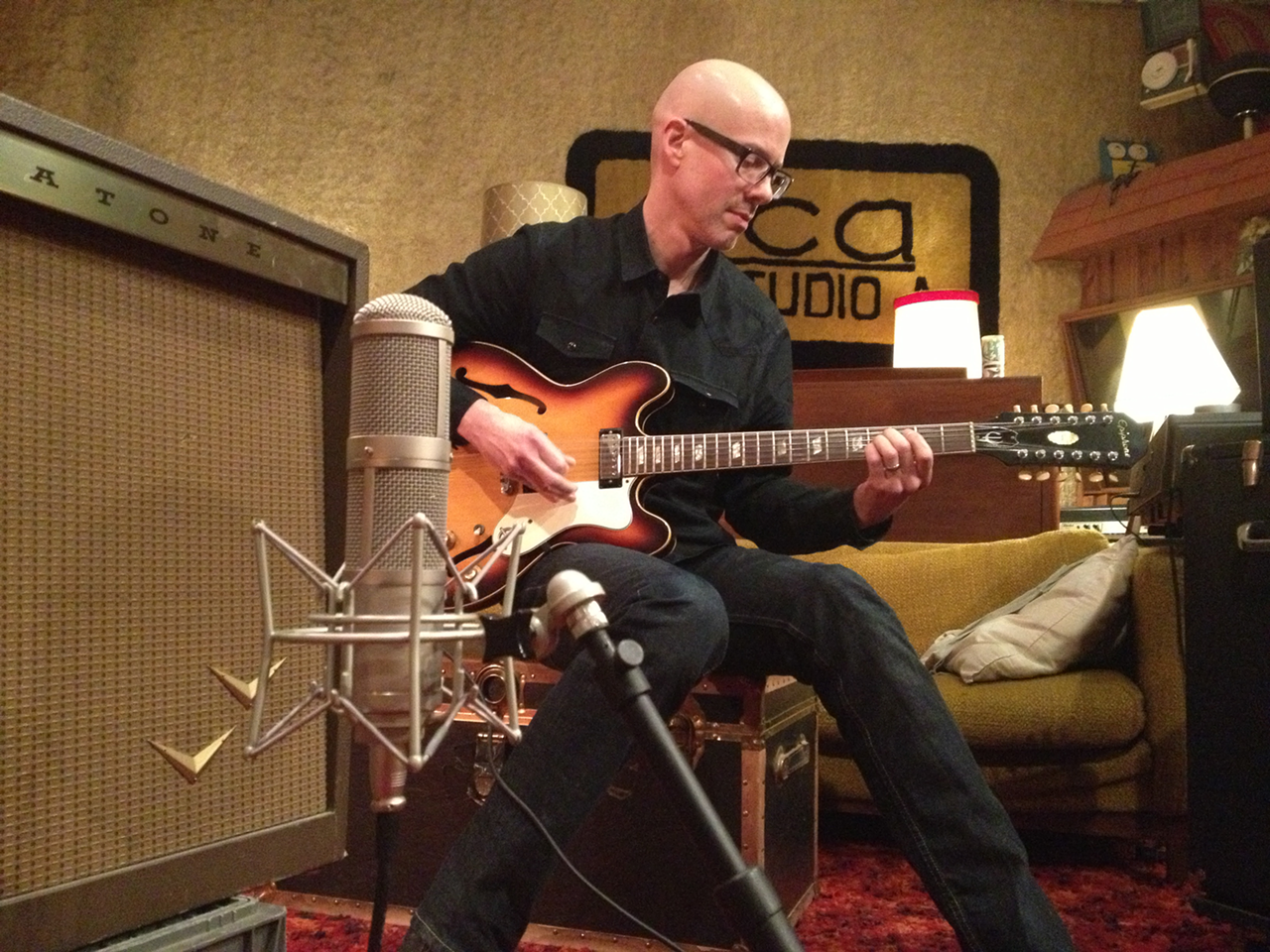Plastic Ants' Robert Cherry recording guitar overdubs during the group's 'Imperial Phase' LP sessions.