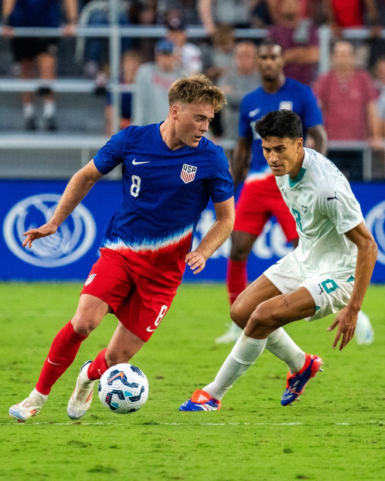 Aidan Morris dribbles up field.