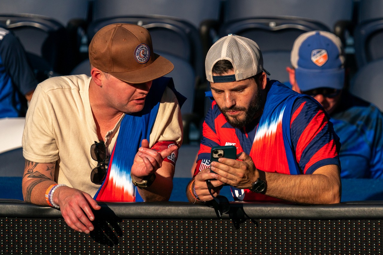 USA fans checking the starting lineup.