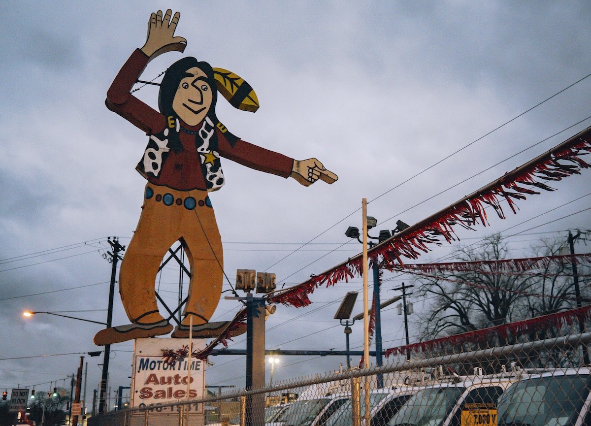 "Big Indian" sign at MotorTime Auto Sales in Carthage