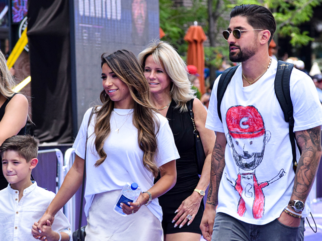Reds outfielder Nick Castellanos steps out with his family in July 2021.