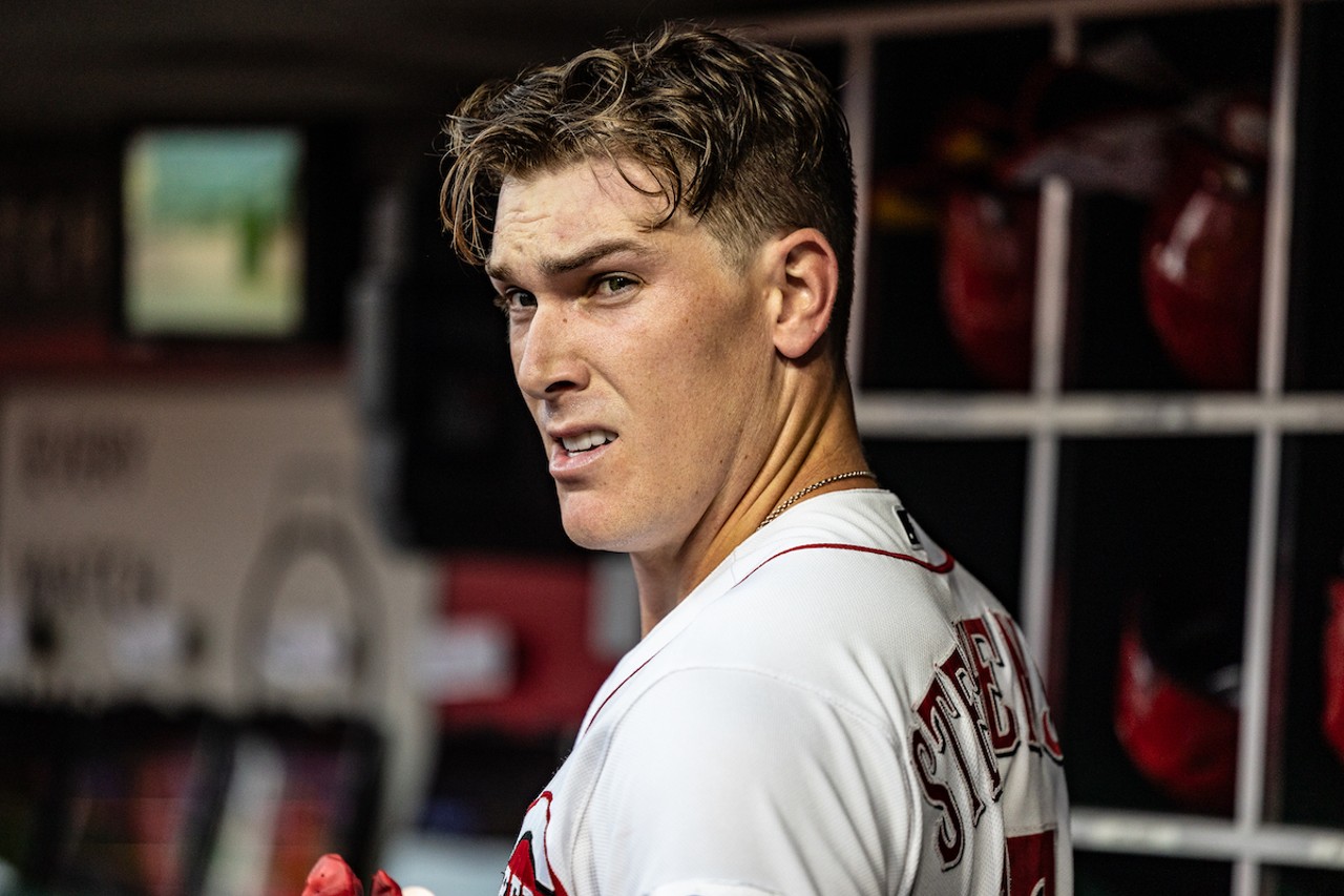 Tyler Stephenson poses candidly for the camera in the dugout | Cincinnati Reds vs. Minnesota Twins | Sept. 18, 2023