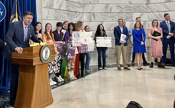 Gov. Andy Beshear and Lt. Gov. Jaqueline Coleman look on as Chris Hartman with the Fairness Campaign introduces the 2024 Fairness Rally in the Capitol Rotunda.