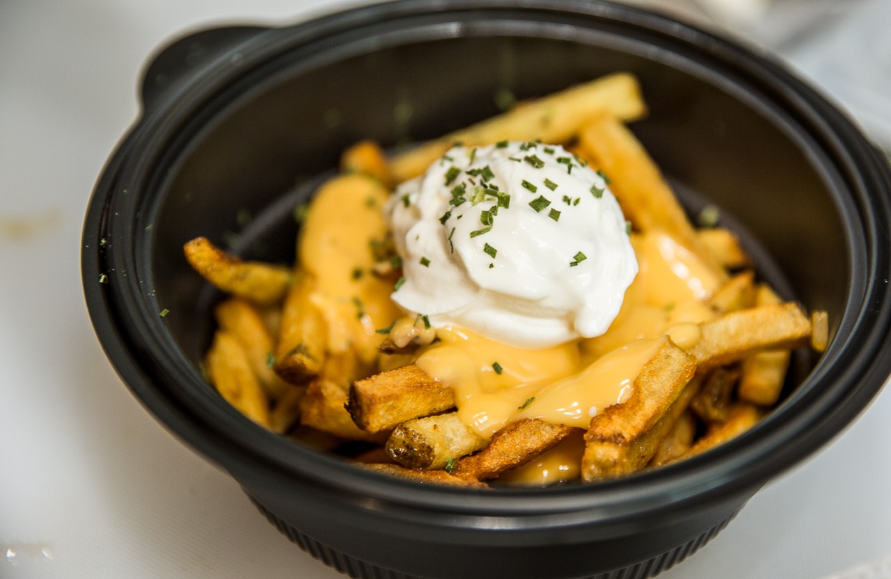 The Alley Fries, with fresh-cut fries, topped with cheddar cheese sauce, bacon, sour cream and chives