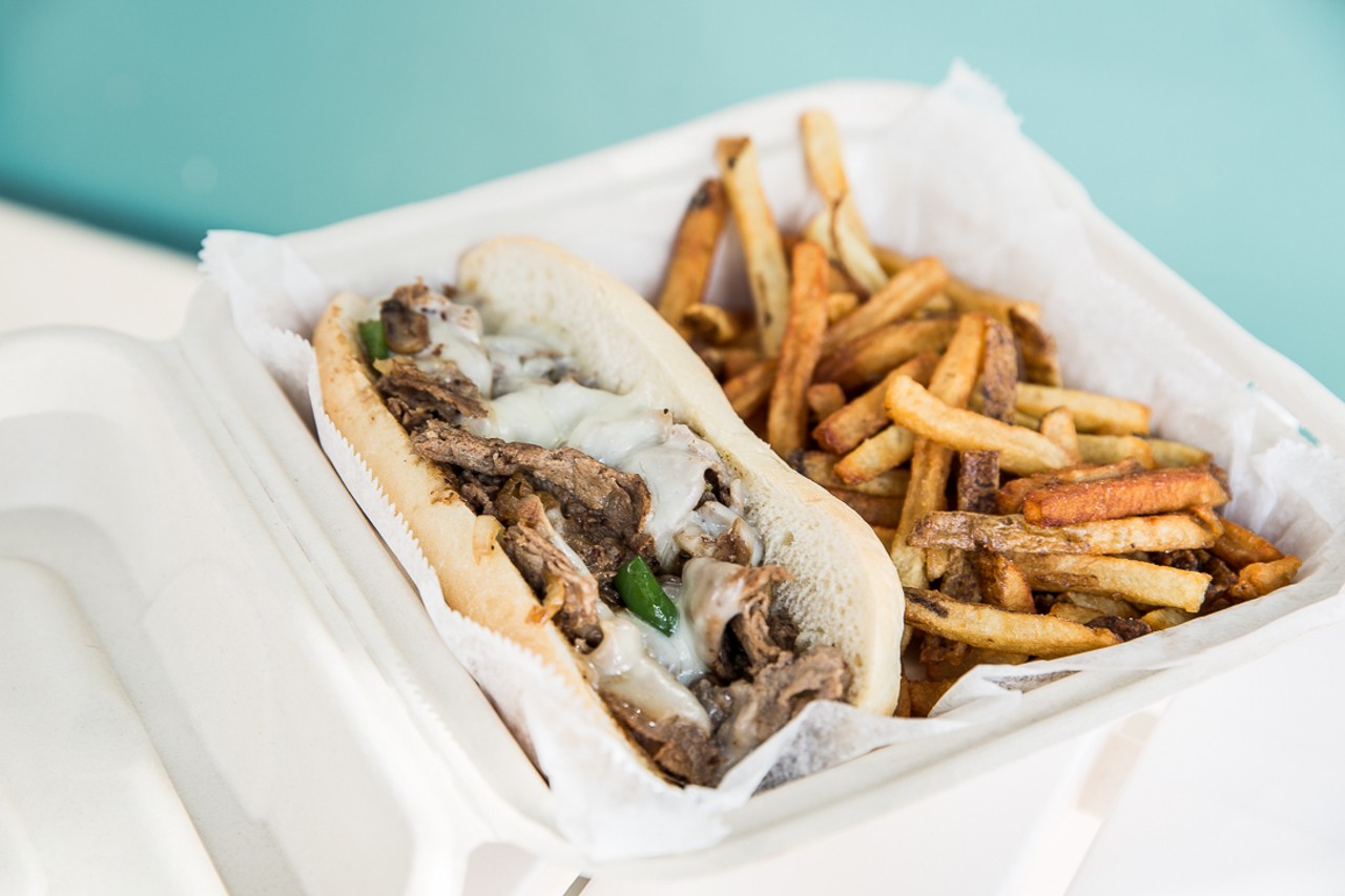 The OTR Philly, with thinly sliced and grilled sirloin steak, topped with provolone cheese, saut&eacute;ed onions, mushrooms, green peppers and mayo with a side of fresh-cut fries