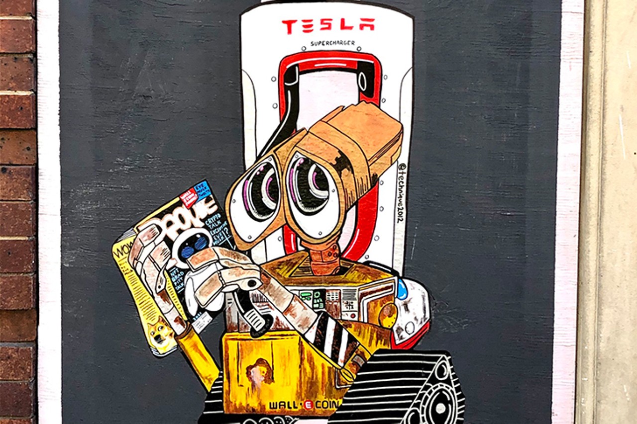 &#147;Wall-E Coin&#148;
Location: Over-the-Rhine
Description: "Wall-E invest all his E coin into Tesla stock but as he&#146;s at the closest supercharger getting his monthly charge a people magazine catches his eyes. Eve Musk just sent out a series of tweets saying he believes dogecoin is the next big crypto currency. He believes this is a power play by Eve to take over E coin earnings all the way to outer space."