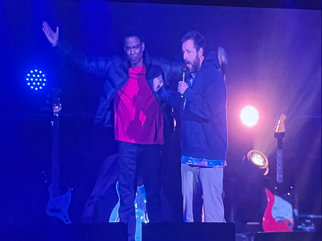 Chris Rock (left) joins Adam Sandler during Sandler's comedy tour stop at Heritage Bank Center in Cincinnati on Feb. 6, 2023.