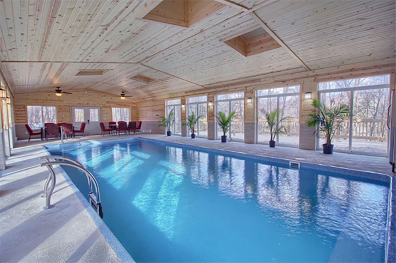 High Point Lodge
Hocking Hills, Ohio
From $900/night | Hosts 26 guests
"Relax, play or exercise in the indoor saltwater pool in the detached pool house &#151; complete with a bathroom, comfortable patio furniture, and full-size refrigerator. Open up the sliding glass doors in the warm months to get the feeling of being outdoors: No sunscreen required! Sunbathe on the attached deck overlooking the expansive front lawn and tree-lined hillside. When the sun sets, cozy up to the fire ring or warm up in the covered hot tub." &#151; Hocking Hills Premier Cabins Photo via hockinghillspremiercabins.com