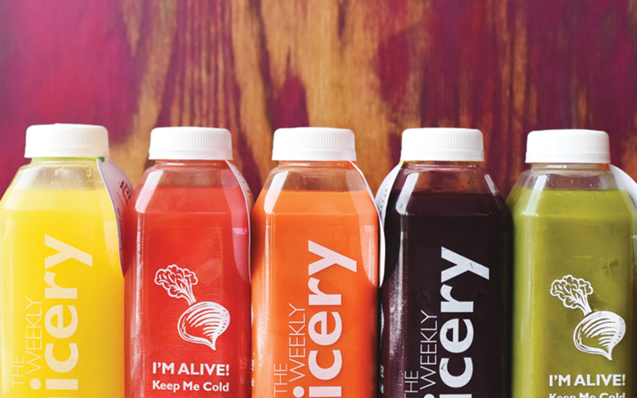 The Weekly Juicery's rainbow assortment of cold-pressed juices.