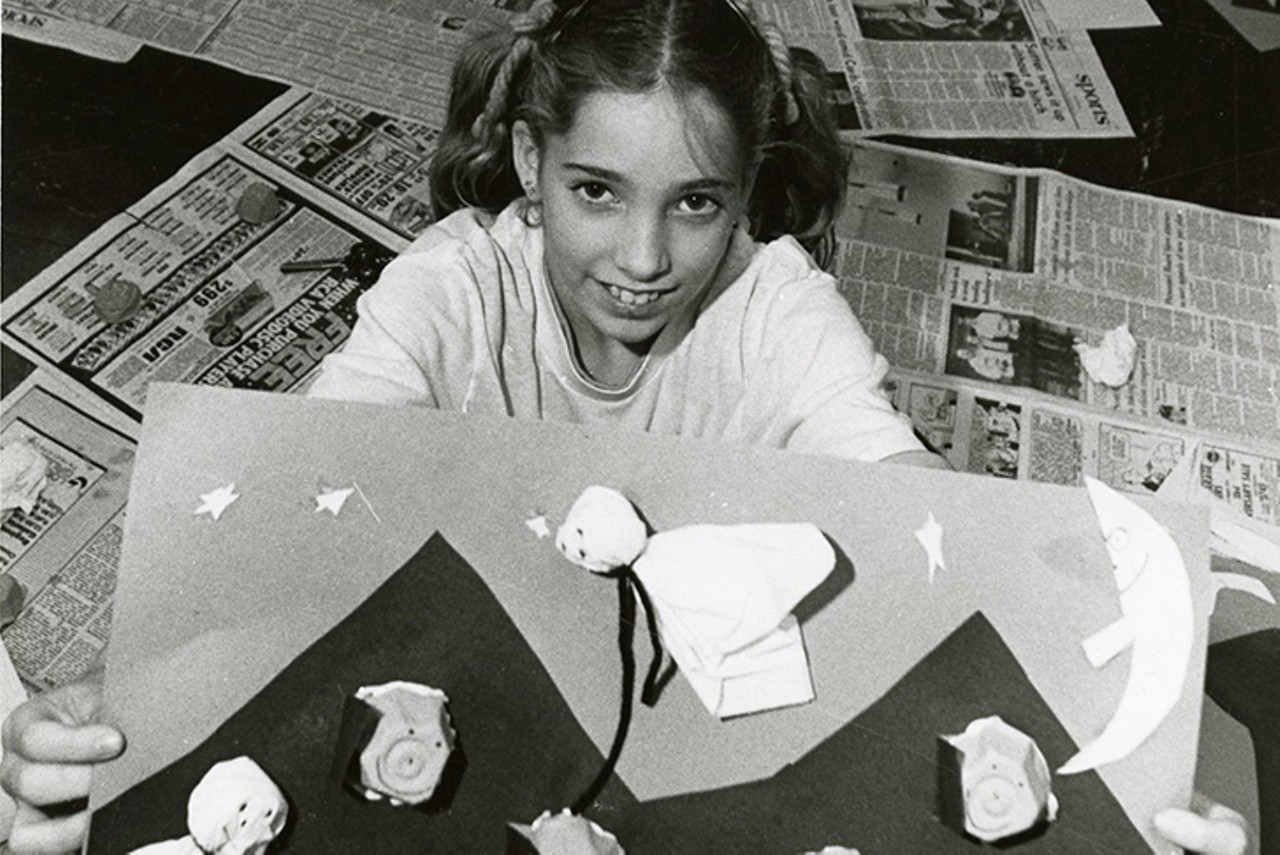 Florence, 1982
"Angel Buchanan (10), Florence Elementary School 5th grader showing off picture she made for halloween in class."