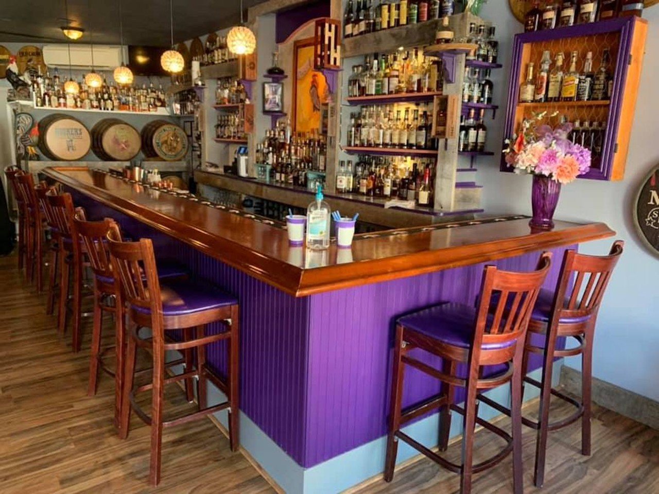 Purple Poulet
846 York St., Newport
Bourbon-bistro Purple Poulet offers its diners a lot of homey, Southern-style charm. The centerpiece of the restaurant is its bar, both the bar’s offerings and the literal bar — like the restaurant’s name, it’s purple and it adds some fun eclecticism to the cute, country-style decor. As for what’s behind the bar, it’s bourbon (and lots of it). Purple Poulet has over 500 bourbons and ryes you can try, and it’s always looking to add to its collection. The restaurant is also well-known for its fried chicken, offering five different ways to try it, including the Fried Chicken and Waffle and "Claim to Fame" dinner. But this isn’t just a fried chicken joint; the Chef Z’s Southern Supper portion of the menu offers up a number of Southern comfort-food dishes, including Z’s Uptown Hot Brown (turkey, ham, bacon, Mornay and fried green tomato on a biscuit), Cola BBQ Ribs and Cornmeal Fried Catfish.