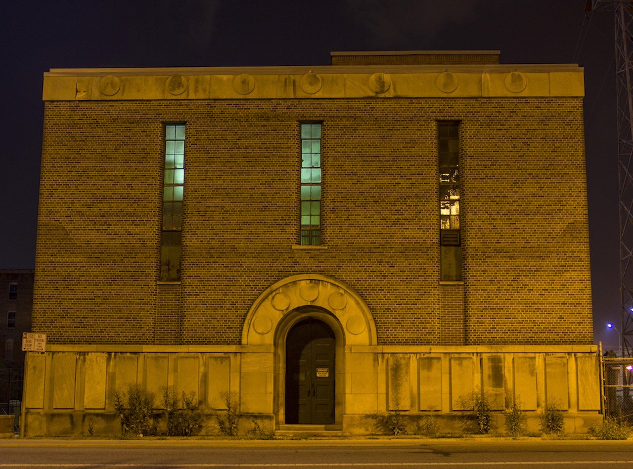 A building on Spring Grove Ave. glows in the darkness