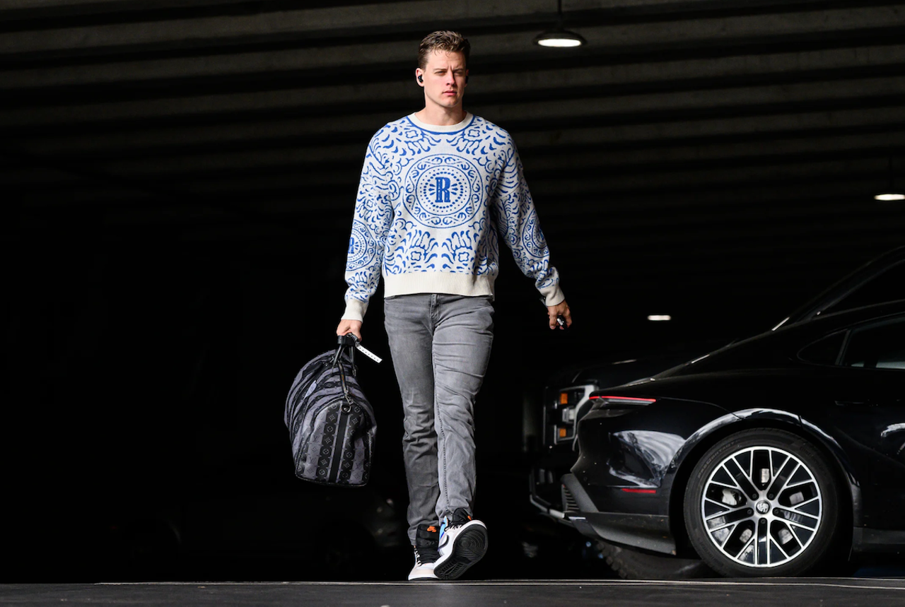 Cincinnati Bengals quarterback Joe Burrow wears a blue and white sweater with grey denim before the game against the Carolina Panthers on Nov. 6, 2022.