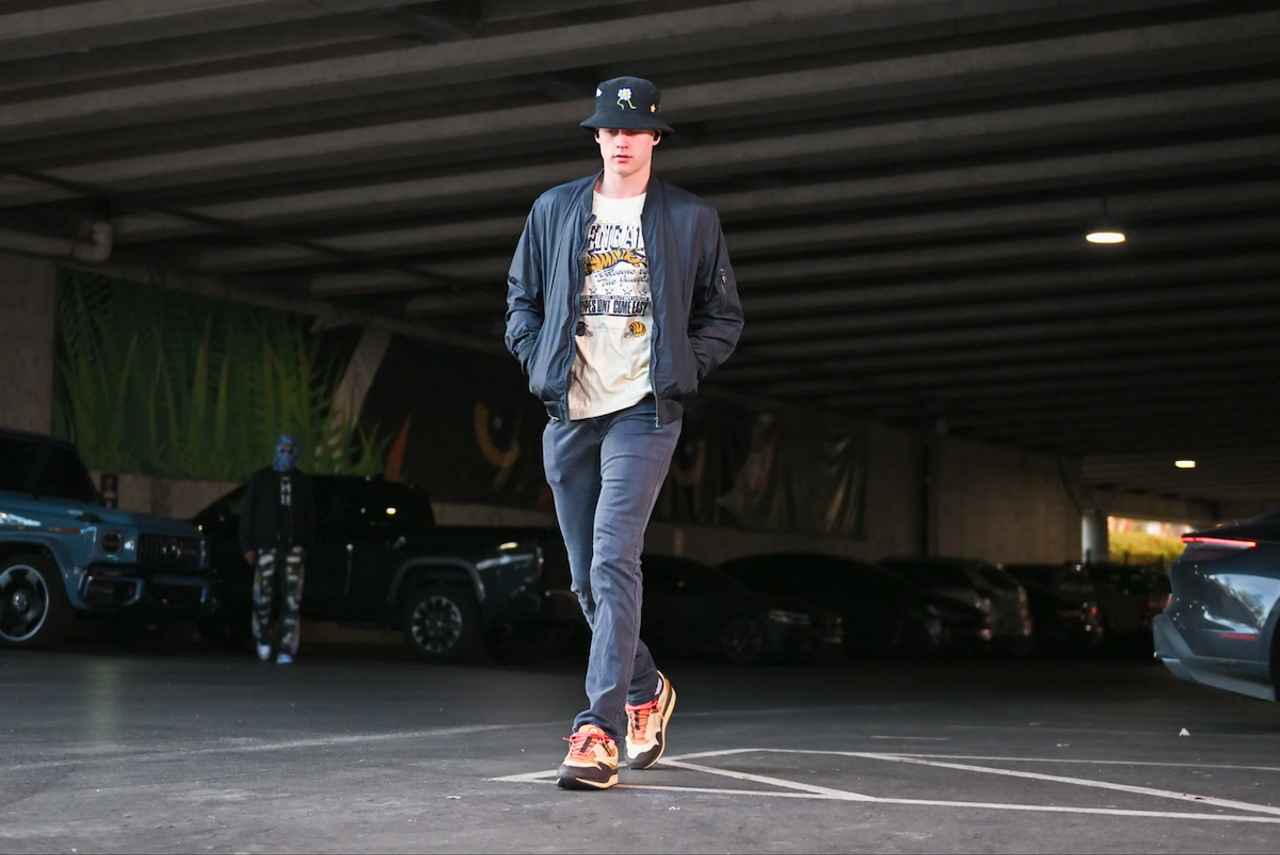 Cincinnati Bengals quarterback Joe Burrow wears a black jacket and floral bucket hat before the AFC wild card game against the Baltimore Ravens on Jan. 15, 2023.