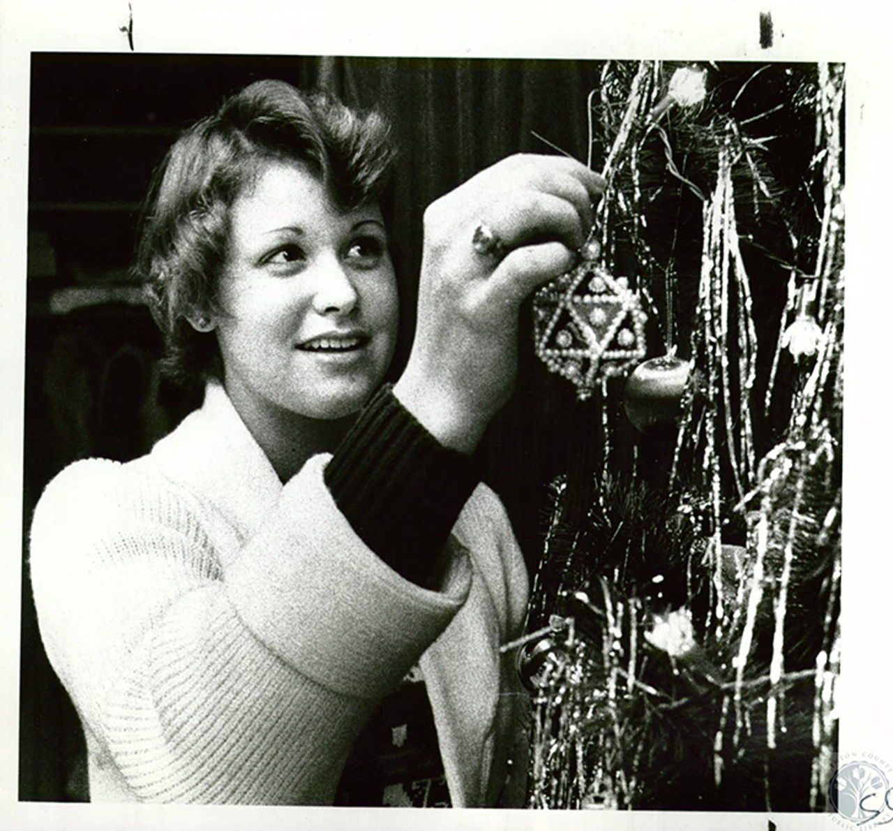 Newport, date unknown
"Joyce Nehus, 18, decorating Christmas tree"