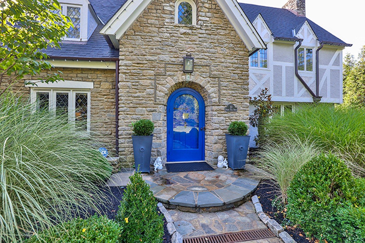 This Charming Hyde Park Tudor Has Not One, But Two Pools in its Backyard Oasis