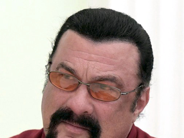Steven Seagal is presented with his Russian passport and congratulated on receiving Russian citizenship
