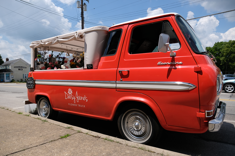 Daisy Jane's Flower Truck isn't easy to miss with its bright red exterior. - Billy Keeney