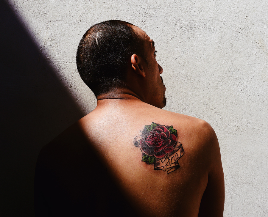 This man got a rose tattoo for his mother. “A couple guys who had been in the United States and been involved in gangs there had been deported,” Becki says. “(He) is one of them. His mother lives in New York and he can’t see her. He’s not allowed to go back even though he’s working on turning his life around.” - Photo: Jesse Fox