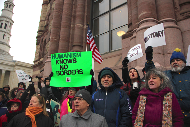 Rally attendees outside Cincinnati City Hall protest President Donald Trump's immigration ban Jan. 30. - Nick Swartsell