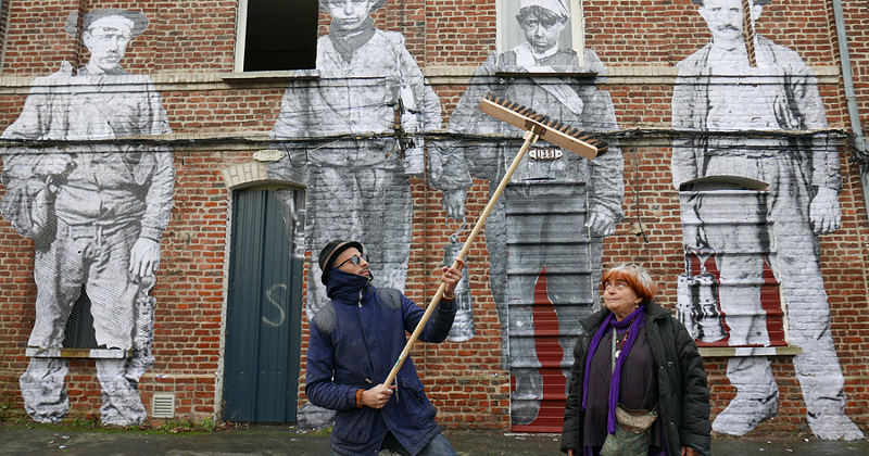 JR working with Agnés Varda on a mural - PHOTO: COURTESY OF COHEN MEDIA GROUP