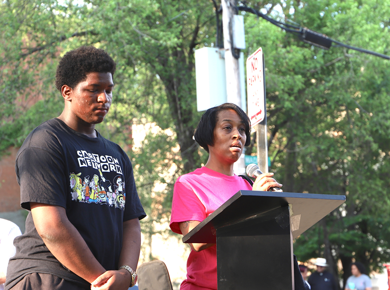 1559 Central Ave. resident Crystal Lane, right, and her son Amier speak at an event in the West End protesting relocation of residents by FC Cincinnati - Nick Swartsell