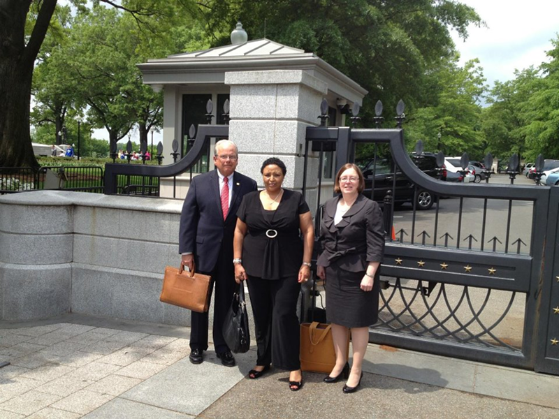 L to R: William J. Moran (President - Board of Trustees), Amina Tuki (library patron) and Kim L. Fender (The Eva Jane Romaine Coombe Director)