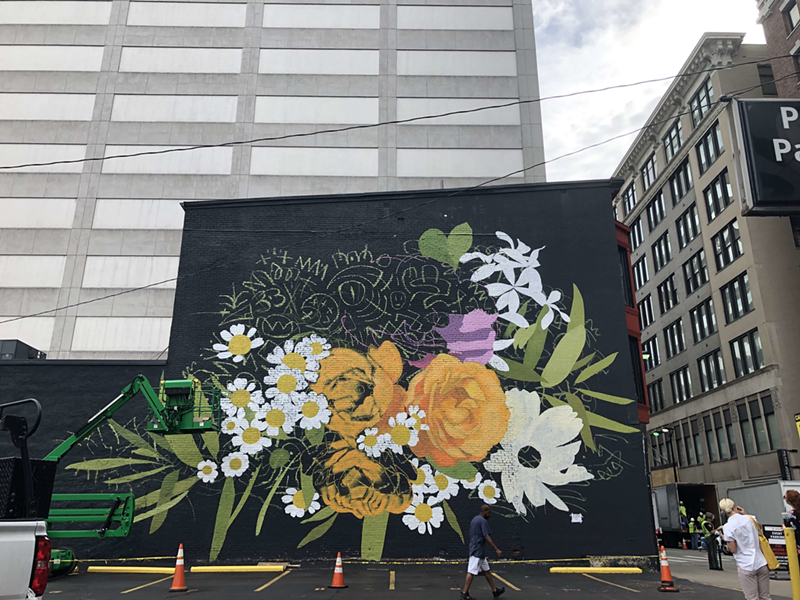In-progress photo of Louise "Ouizi" Jone's new mural on the 7th and Vine Street. - Courtesy of ArtWorks