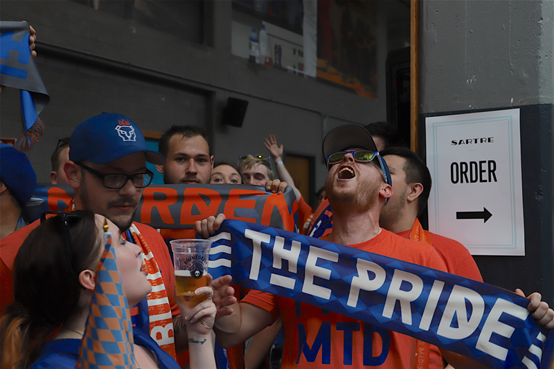 Fans celebrate during the announcement of FC Cincinnati's acceptance into Major League Soccer at Rhinegeist Brewery. - Nick Swartsell