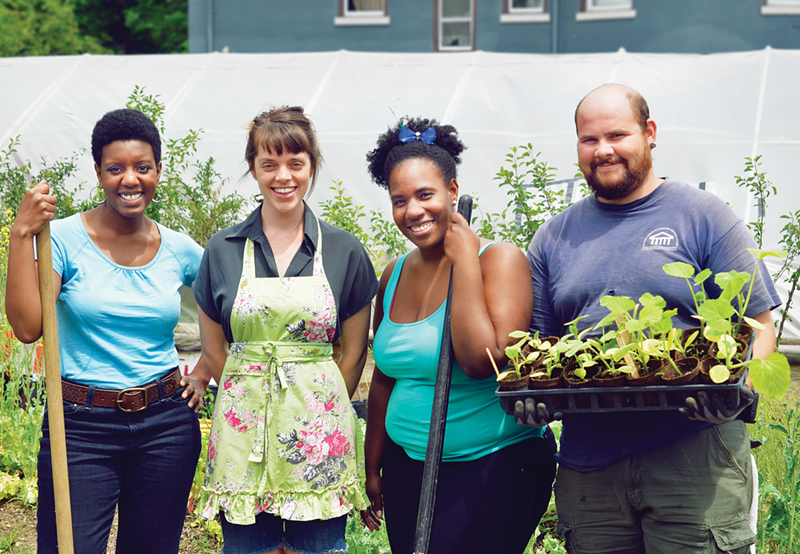 L to R: Leslie Stevenson, Kristen St. Clair, Tahshara Boochee and Dustin Lee work in the community garden