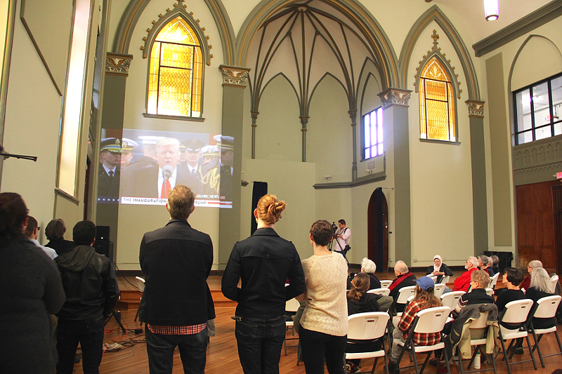 About 50 people watch President Donald Trump deliver his inauguration speech at nonprofit Community Matters in Lower Price Hill - Photo: Nick Swartsell