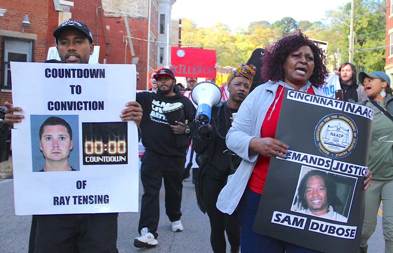 Audrey DuBose (right) leads an Oct. 22 march through Mount Auburn and Over-the-Rhine ahead of the trial for Ray Tensing, the former UCPD officer who shot her son Sam DuBose. - Nick Swartsell